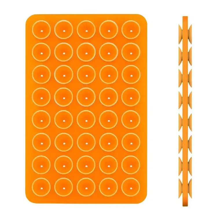 Hands-free phone holder featuring an orange silicone mold with circular shapes for creative use.