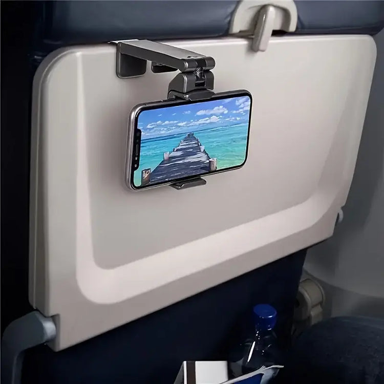 hands-free phone holder for car and desk mounted on airplane seat back with smartphone displaying scenic view.