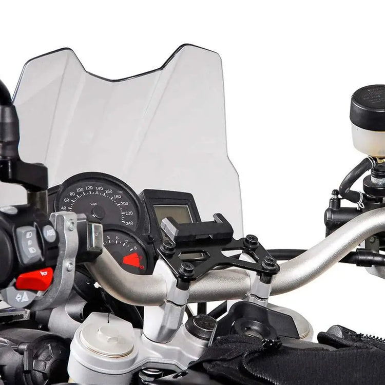 Image of a KTM 990 Adventure phone holder mounted on motorcycle handlebars.