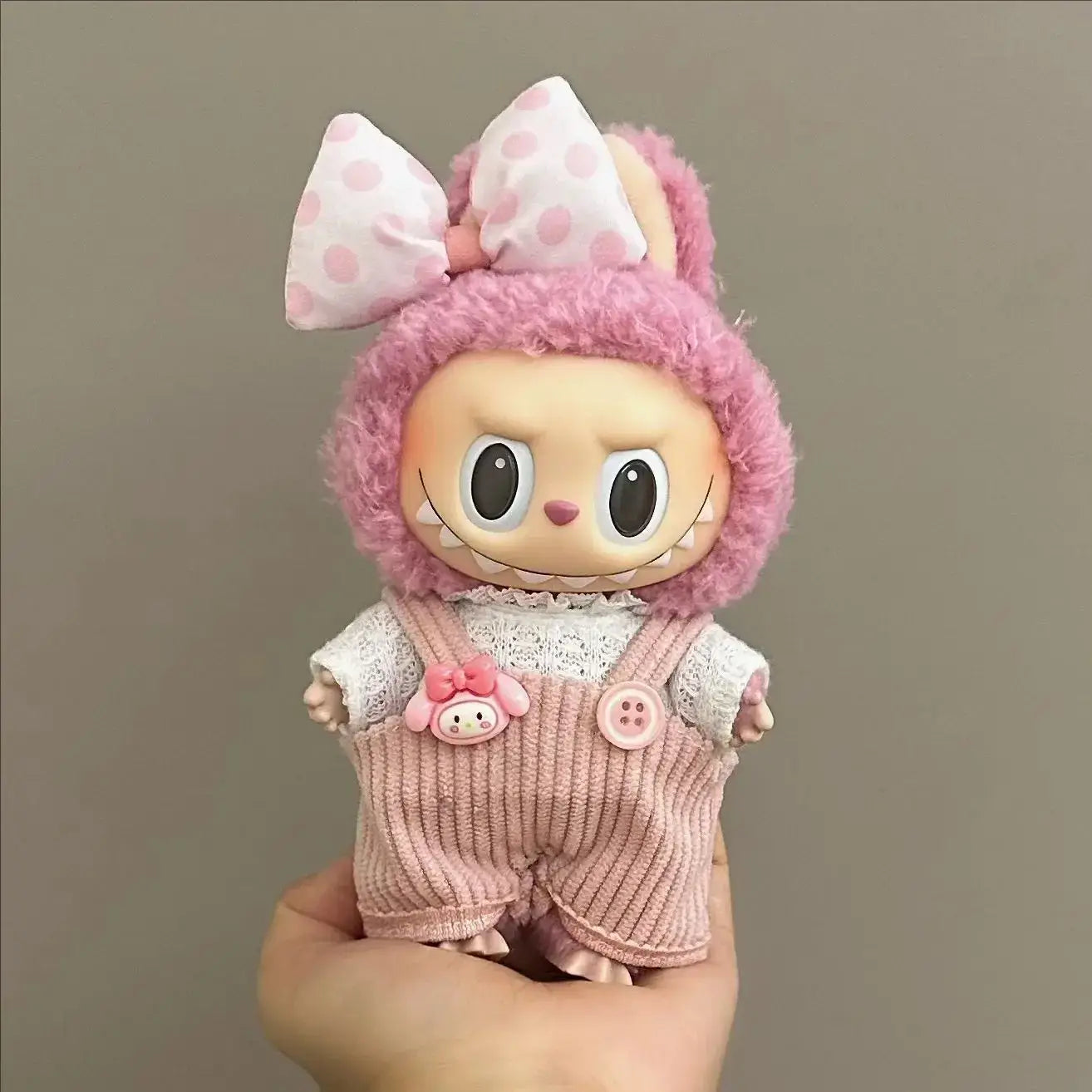 Labubu doll clothes 17cm featuring a cute doll in bunny outfit with pink suspenders and polka dot bow.