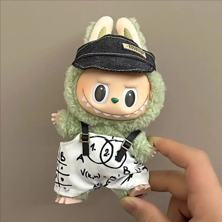 Labubu doll clothes 17cm on a cute green character wearing a black cap and math-themed shorts.