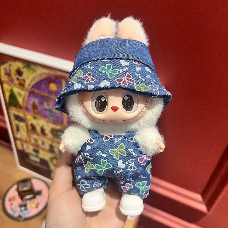 Labubu doll clothes 17cm on a cute doll wearing a denim outfit with a colorful patterned hat.