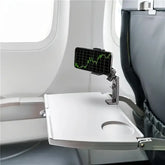 hands-free phone holder for car and desk attached to an airplane tray table with a phone displaying graphs