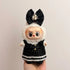 Labubu doll clothes 17cm dressed in a stylish black outfit with a large bow and pearl accents.
