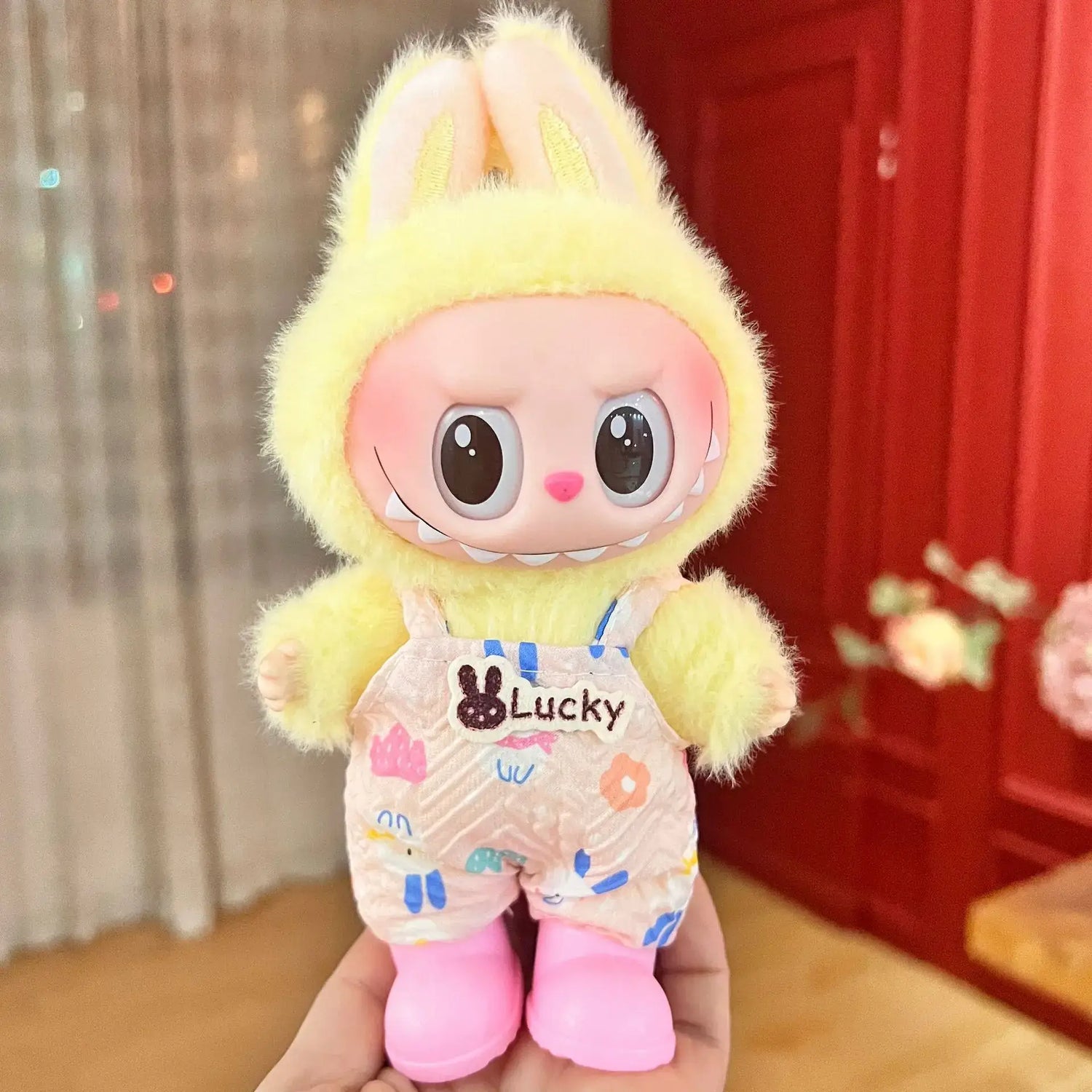 Labubu doll clothes 17cm featuring a cute yellow bunny outfit for playful dolls.