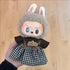 Labubu doll clothes 17cm on a cute doll wearing a rabbit costume with a smile sign and houndstooth skirt.