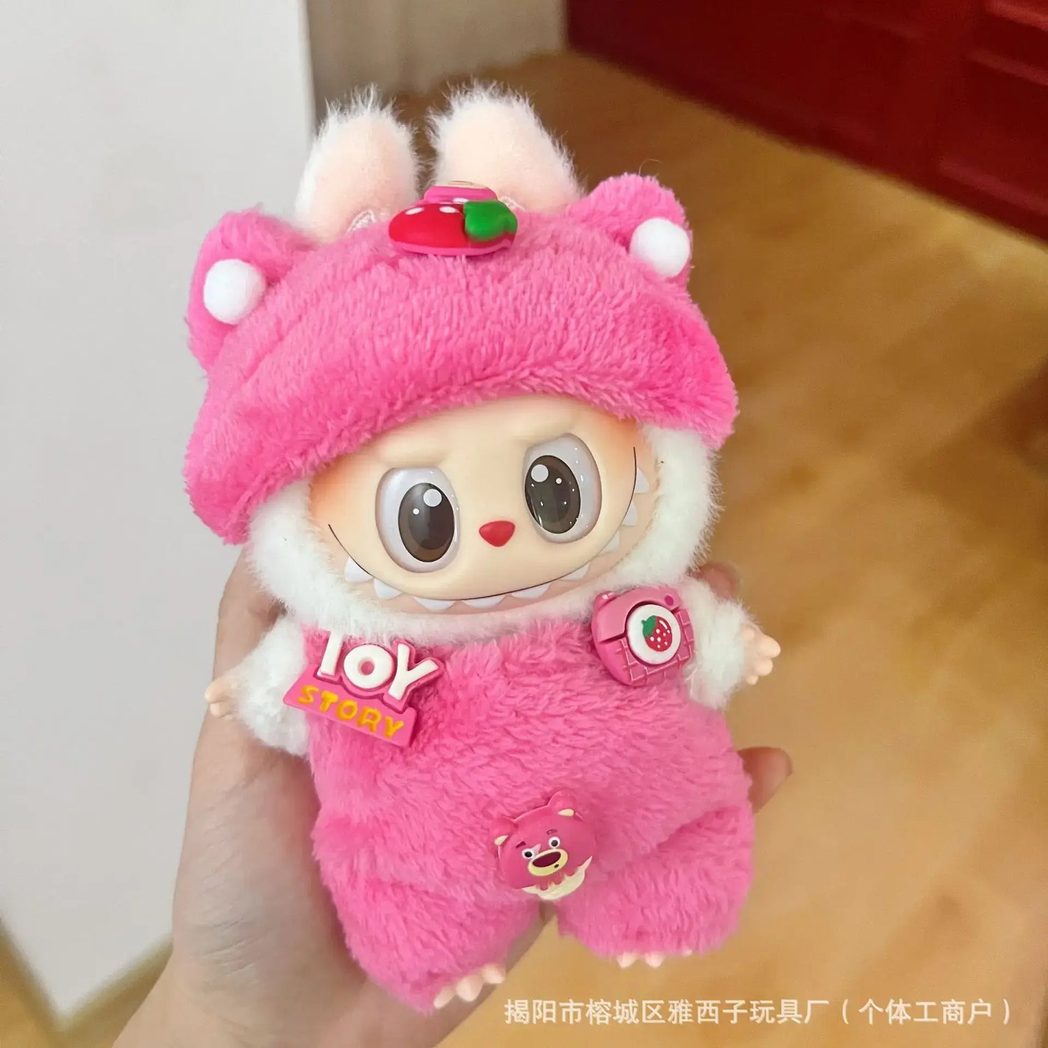 Labubu doll clothes 17cm on a cute plush doll wearing a pink outfit with bear ears, showcasing stylish casual wear.