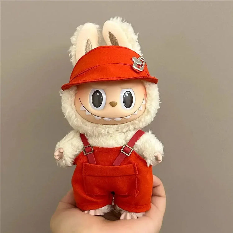 Labubu doll clothes 17cm model dressed in red outfit with hat and overalls, showcasing trendy casual style.